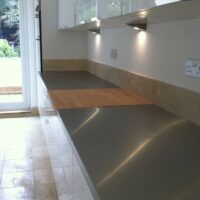 stainless steel and white gloss kitchen